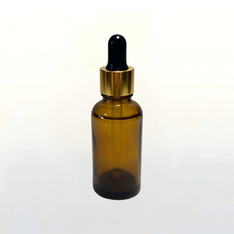 30ml amber glass serum bottle with electroplated gold dropper cap for UV-sensitive cosmetics