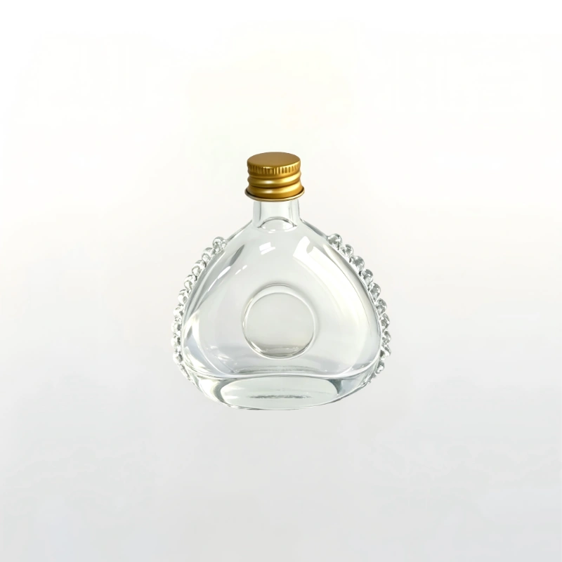 Gallery of 60ml clear vintage spirits glass bottle with gold cap, showing front, side, and angle views