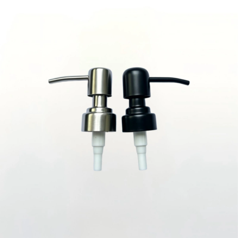 Heavy duty stainless metal pump head fitted on glass soap and lotion bottle